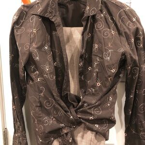 Floral Embroidered Brown Blouse and tan dress pants.
